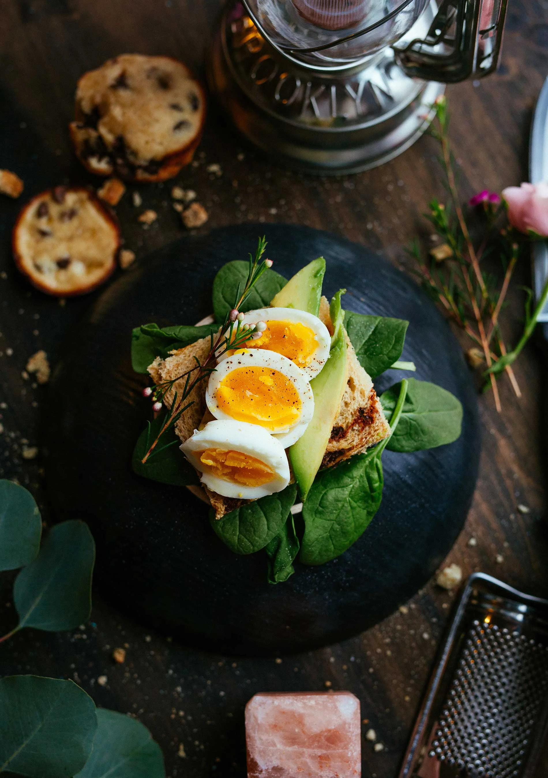 Egg and avocado toast on spinach